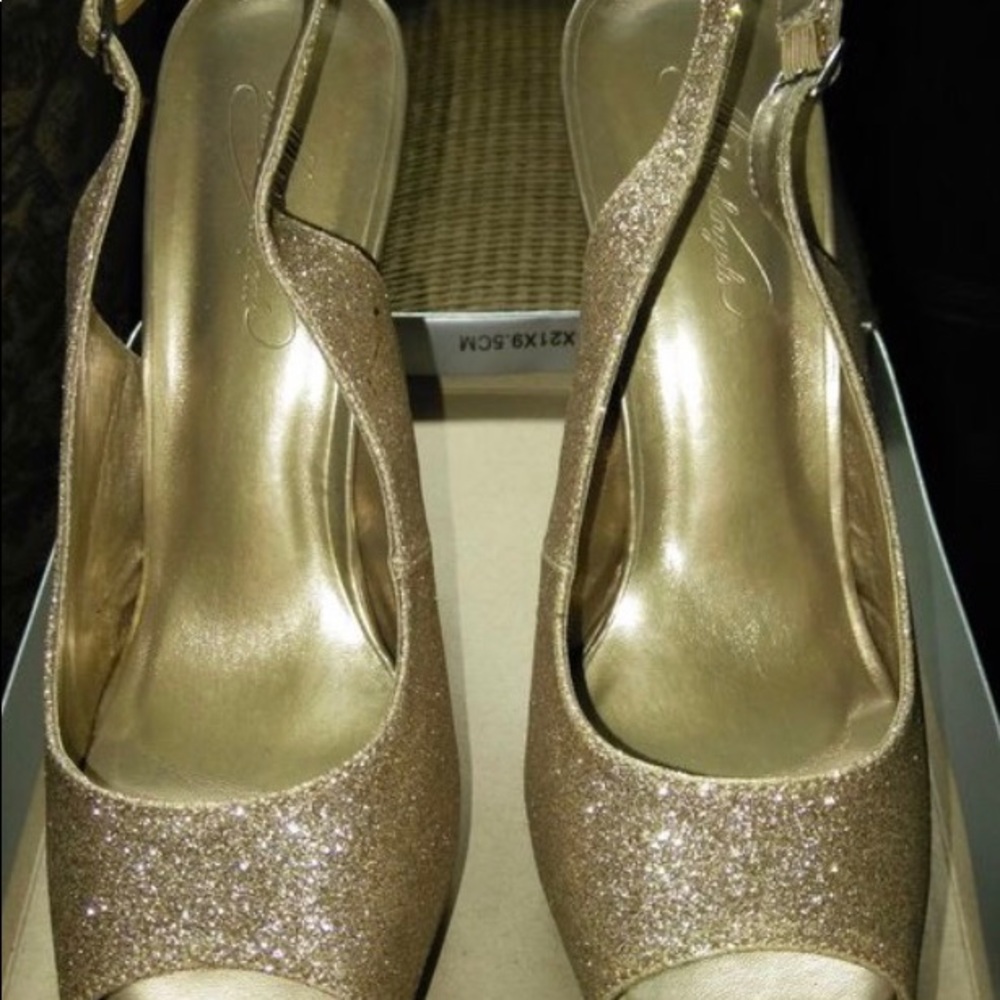 Gold glitter pumps with sling back buckle.